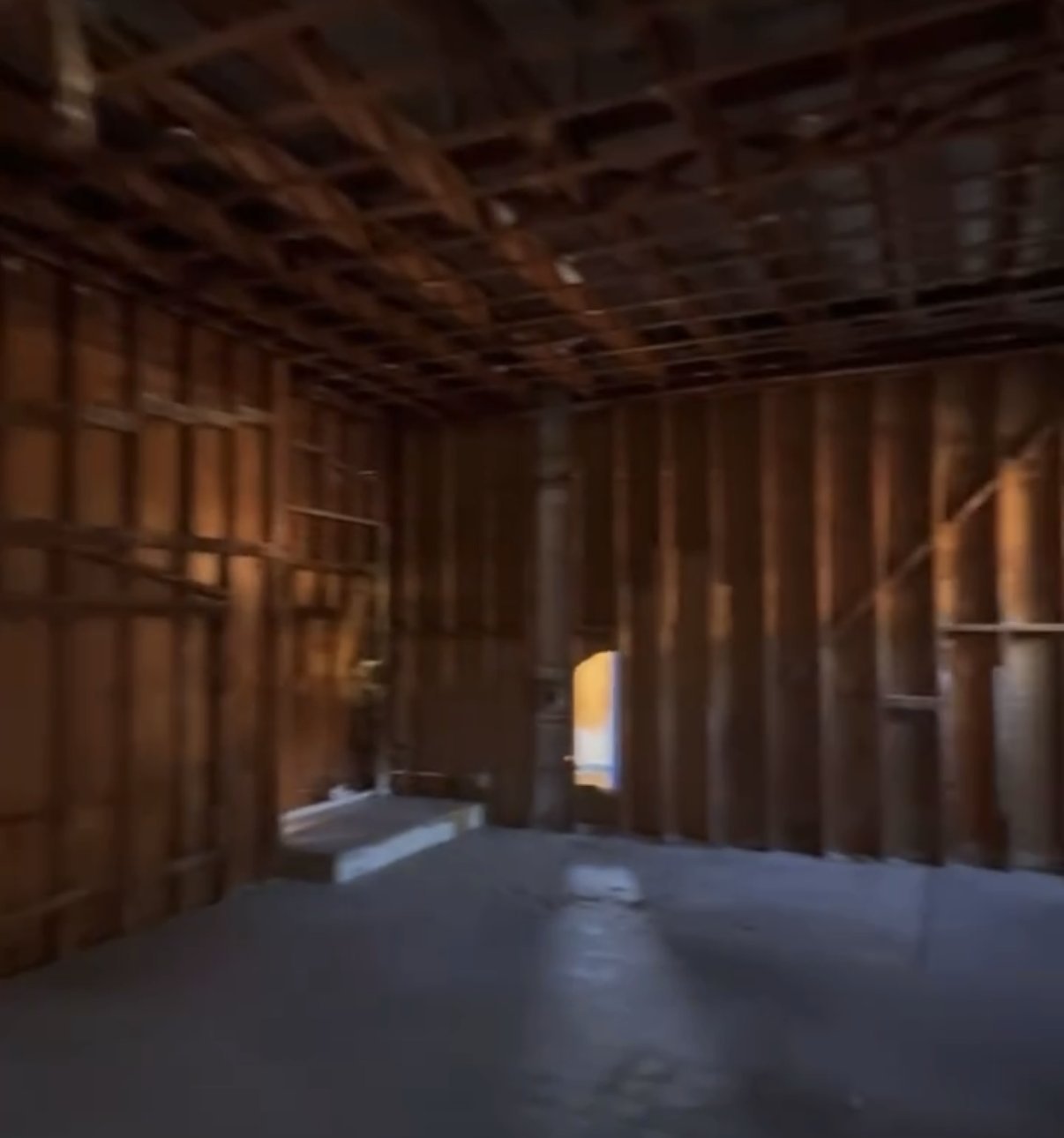 Gutted, fire-damaged interior being rebuilt