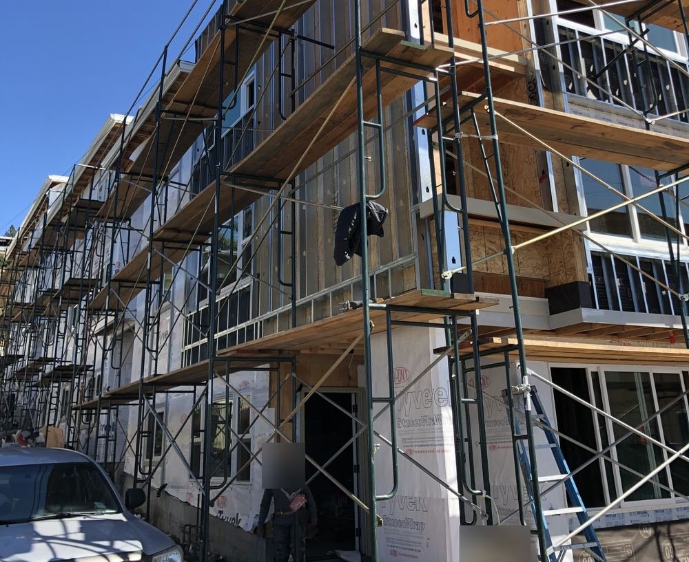 Apartment building under construction with scaffolding